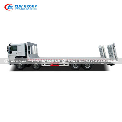 Sinotruk HOWO 8x4 400HP Flatbed Truck with 9m Manganese Steel Deck and Hydraulic Ramp for Heavy Machinery Transport