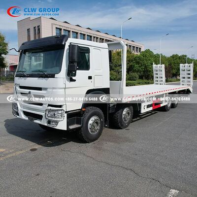 Sinotruk HOWO 8x4 400HP Flatbed Truck with 9m Manganese Steel Deck and Hydraulic Ramp for Heavy Machinery Transport