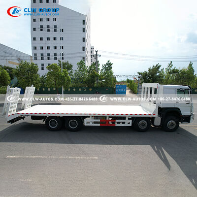 Sinotruk HOWO 8x4 400HP Flatbed Truck with 9m Manganese Steel Deck and Hydraulic Ramp for Heavy Machinery Transport