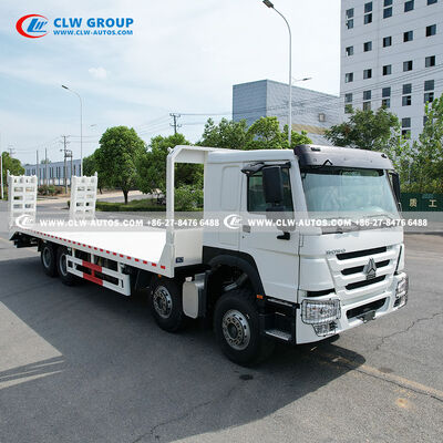 Sinotruk HOWO 8x4 400HP Flatbed Truck with 9m Manganese Steel Deck and Hydraulic Ramp for Heavy Machinery Transport